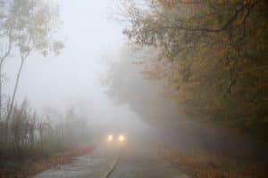 Car driving in fog. Book your fall car service at Supertech Auto Repair North Vancouver