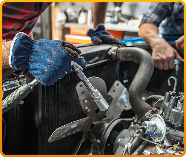 Two mechanics repairing engine